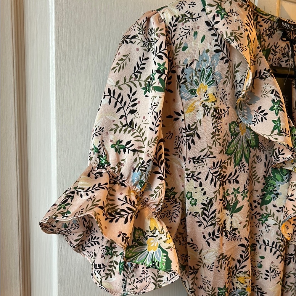 Romantic floral wrap dress with ruffles.